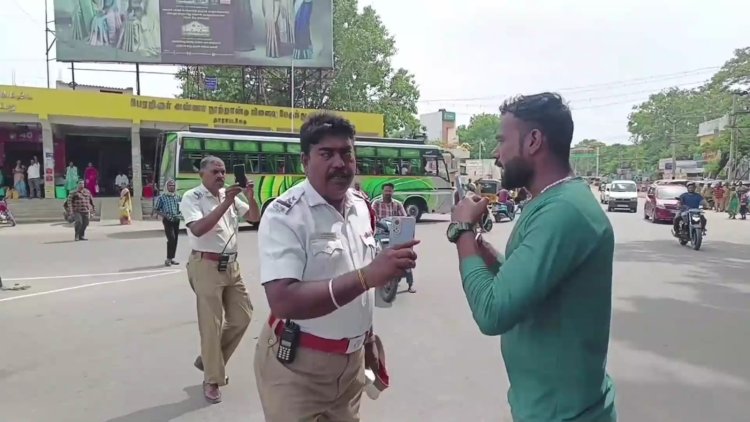 விதிமீறி வாகனத்தை ஓட்டியவரை மடக்கிய போலிசார்! மிரட்டப்பட்டதால் மக்கள் சூழந்தனர்!